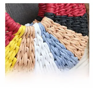 Macro view of multi-colored spiral woven texture on a rainbow straw beach tote