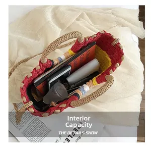 Top view of spacious woven straw tote showing inner capacity with books and accessories