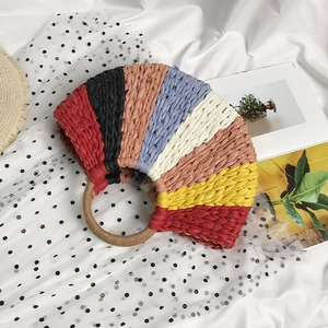 Rainbow striped straw beach bag with semi-circle woven design and round top handles