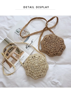 Detail display of flower-shaped woven crossbody bags in tan and dark brown raffia