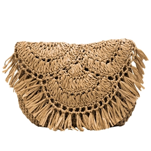 Handcrafted semi-circle straw beach bag with bohemian fringe tassels in natural earth tones