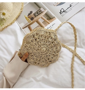 Close-up of handmade hollow floral woven beach bag with delicate wavy petal edges
