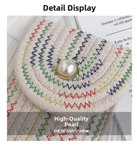 Close-up of cotton woven bag with colorful wave stitching and large pearl buckle detail