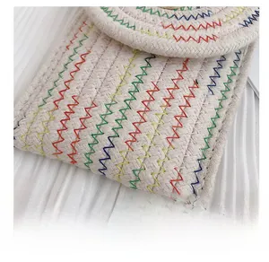 Detail showing multicolored zigzag stitching on minimalist woven cotton rope purse