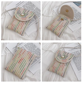 Detailed view of woven cotton rope crossbody phone bag with wavy embroidery and pearl button