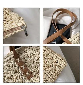 Detailed macro view of woven straw texture, brown faux leather handle and zipper closure