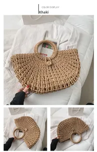 Detail of a large khaki straw woven bag with hollow design and round handle for beach