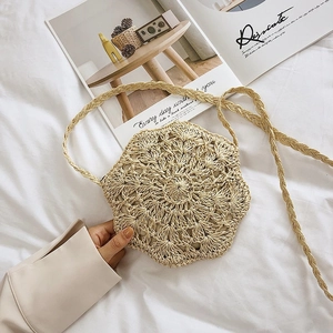Handmade crochet straw shoulder bag with floral hollow pattern and wavy edges for summer