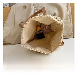 Top view of straw tote bag interior showing beige fabric lining and storage capacity