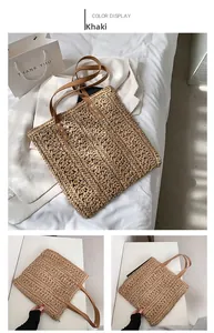 Detail view of khaki woven straw tote bag featuring brown leather straps and knit texture