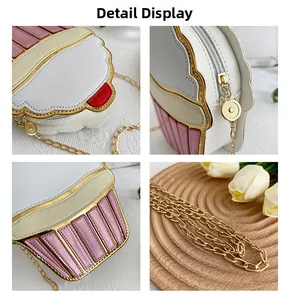 Detail view of pink cupcake chain bag with gold metal hardware and zipper closure