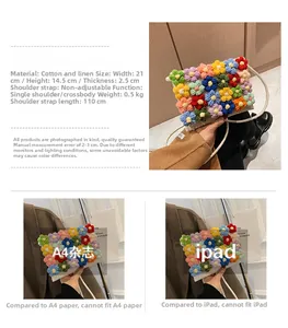 Handmade crochet floral crossbody bag showing size comparison with iPad and A4 magazine