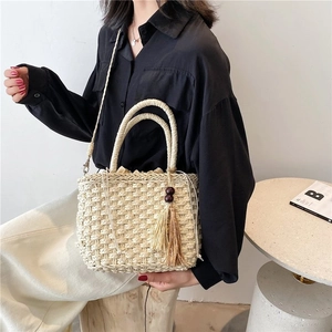 Retro cream straw handbag with wood bead tassel and drawstring liner for women
