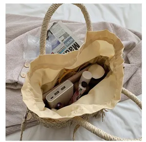 Large capacity vintage straw handbag with fabric lining and drawstring closure for summer
