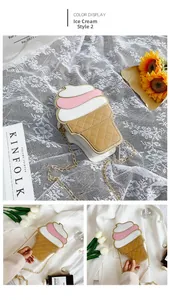 Detail of pink ice cream cone shaped crossbody bag with quilted texture and gold chain strap