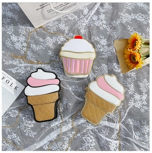 Detail of cute ice cream and cupcake shaped crossbody bags with gold chain straps