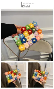 Detail of khaki crochet shoulder bag featuring colorful handcrafted woven flower patterns