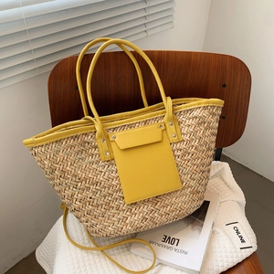 Retro woven straw tote bag with yellow leather trim and adjustable shoulder strap