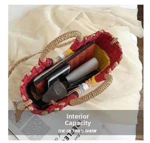 Interior view showing spacious capacity of the woven straw tote with various essentials