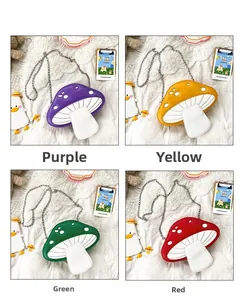 Detail view of colorful mushroom-shaped crossbody bags with silver chain straps