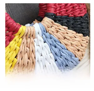 Detailed close-up of colorful handwoven raffia texture with intricate stitching craft
