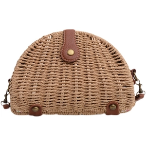 Handwoven semi-circle straw beach bag with brown leather trim and retro metal hardware