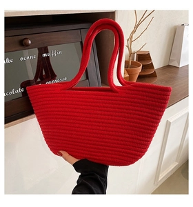 Detail view of the red cotton rope woven tote bag featuring a textured horizontal knit pattern