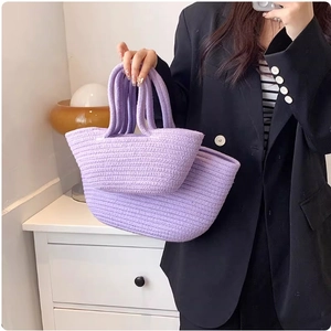 Set of two purple cotton rope woven tote bags for women and kids shown in hand