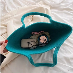 Detailed top view of peacock blue woven tote bag showing internal storage capacity