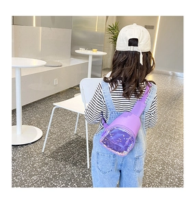 Detail of children's purple cylindrical bag with transparent PVC window and sequins