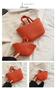 Detail of orange woven cotton rope handbags in large and small sizes for summer leisure