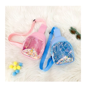 Detail of pink and blue kids PVC chest bags with colorful quicksand glitter stars