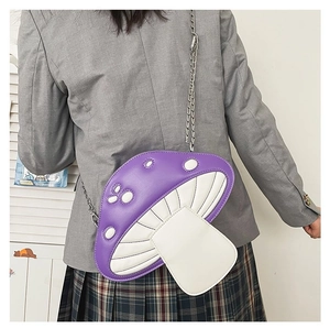 Back view of a girl wearing a purple and white mushroom-shaped chain crossbody bag