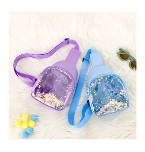 Detail of kids transparent PVC chest bags with colorful moving sequins and glitter
