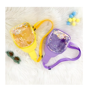Detail of vibrant yellow and purple PVC chest bags with colorful floating sequins for kids