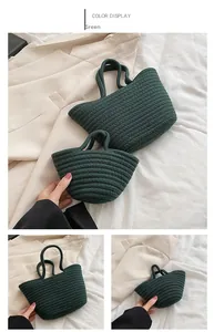 Detail of dark green woven nesting handbags with cotton rope texture and thick dual handles