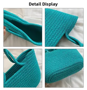 Close-up detail of blue woven cotton rope handbag showing texture and craftsmanship