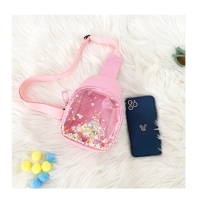 Pink kids chest bag with clear PVC window and colorful sequins on white plush background
