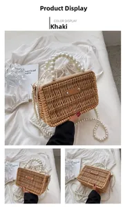 Detail of khaki woven straw handbag with large faux pearl handle and drawstring lining