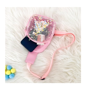 Pink PVC chest bag with glitter sequins and interior storage for small items