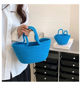 Close-up of klein blue hand-woven cotton rope tote bags in large and small sizes