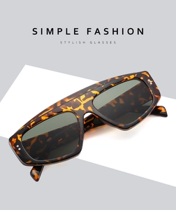 Macro shot of stylish tortoiseshell sunglasses with silver rivet accents and dark lenses
