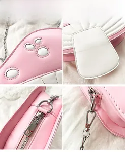 Detail showing pink mushroom crossbody bag with chain strap and silver metal hardware