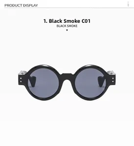 Detailed view of glossy black round frames with silver rivets and smoke grey lenses