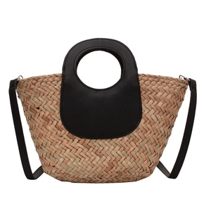 Handwoven straw bucket bag with black leather handles and shoulder strap for summer