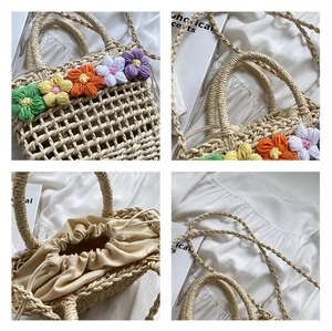 Detail of hand-woven straw bag featuring colorful crochet flowers and drawstring liner