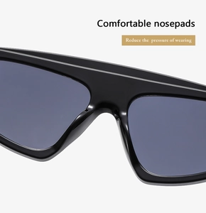 Detail view of smooth integrated nose pads on black cat-eye sunglasses for comfortable wear
