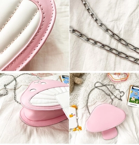 Detail shot of pink mushroom bag stitching and silver metal chain strap texture