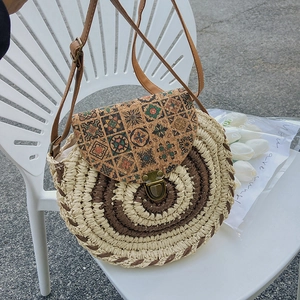 Retro round woven straw shoulder bag with floral cork flap and brown leather strap