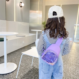 Purple PVC child chest bag with sparkling sequins shown on model in a modern interior